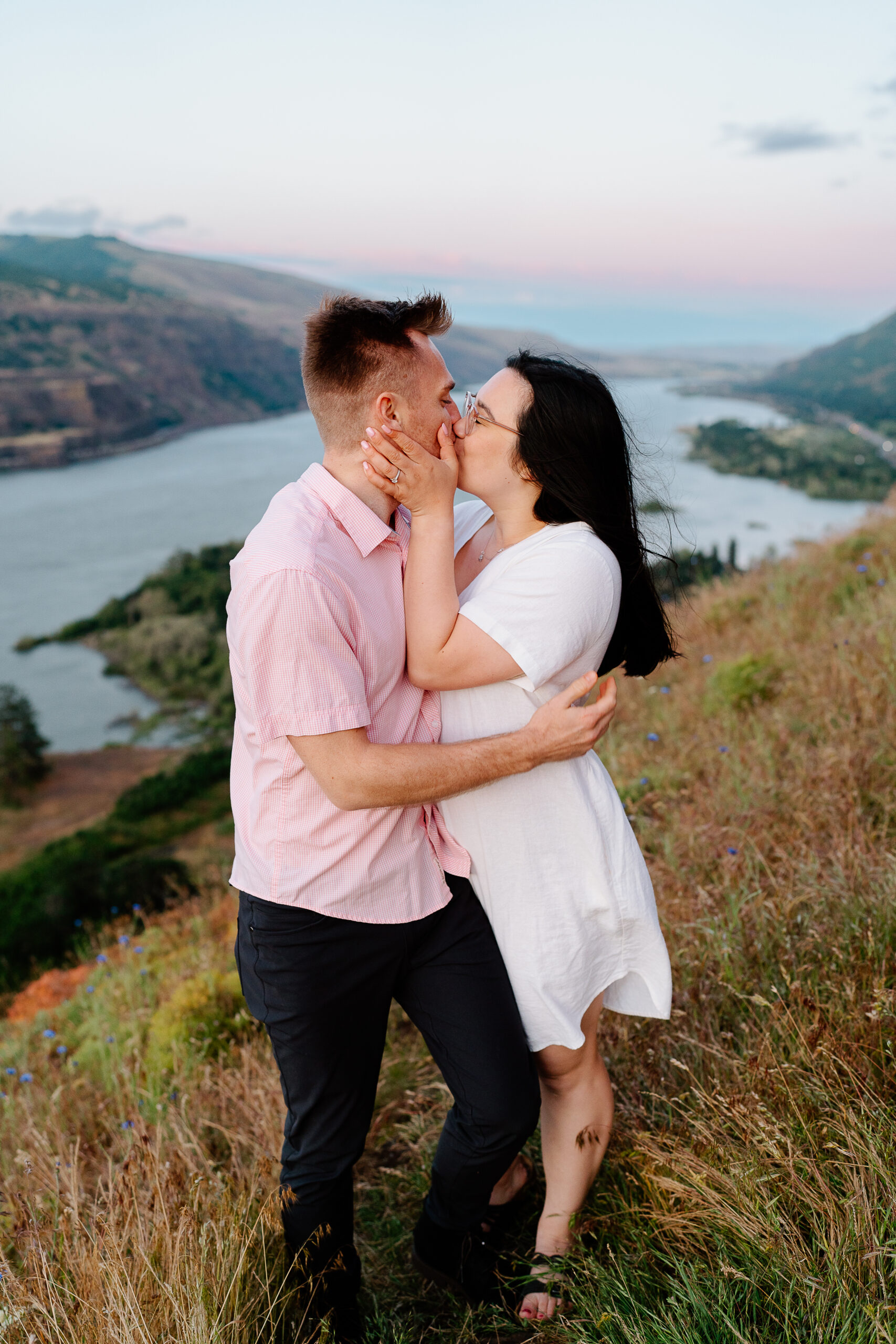 Couple kissing during blue hour engagement photos in the Columbia River Gorge.