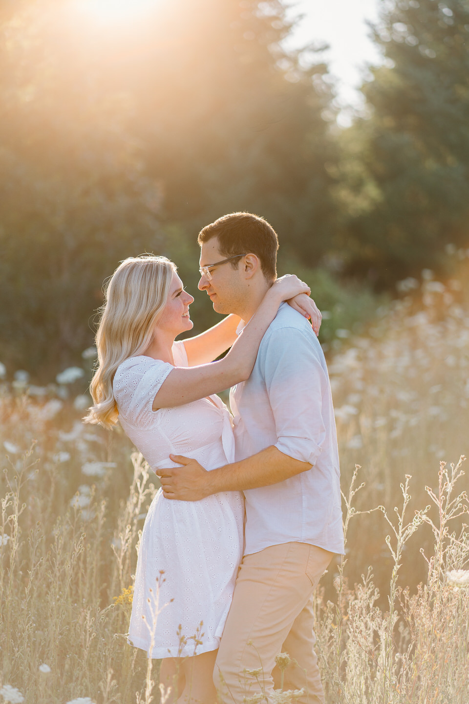 Golden hour engagement session with couple facing each other and hugging in Graham Oaks Park in Wilsonville.