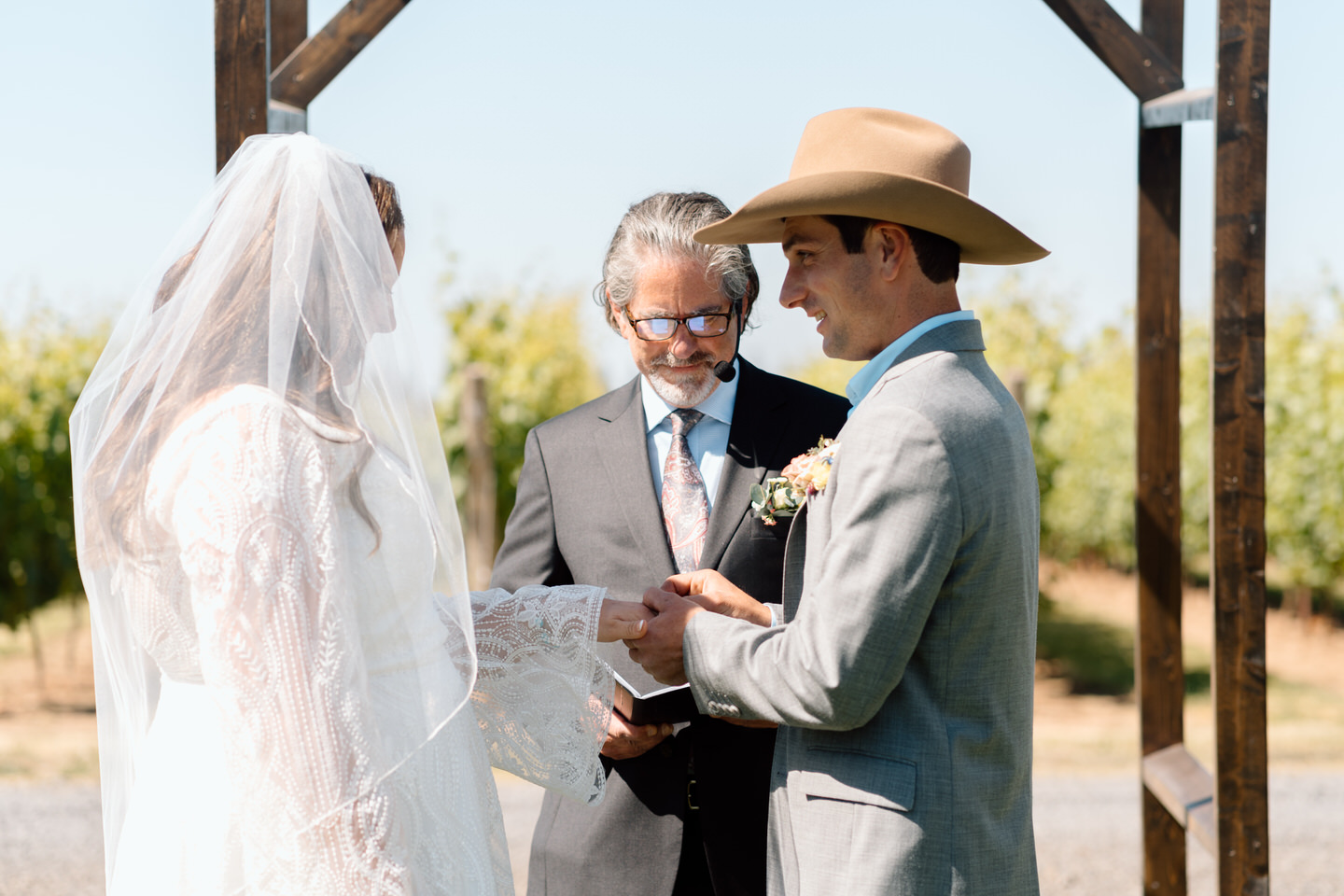 Exchange of rings during vineyard wedding