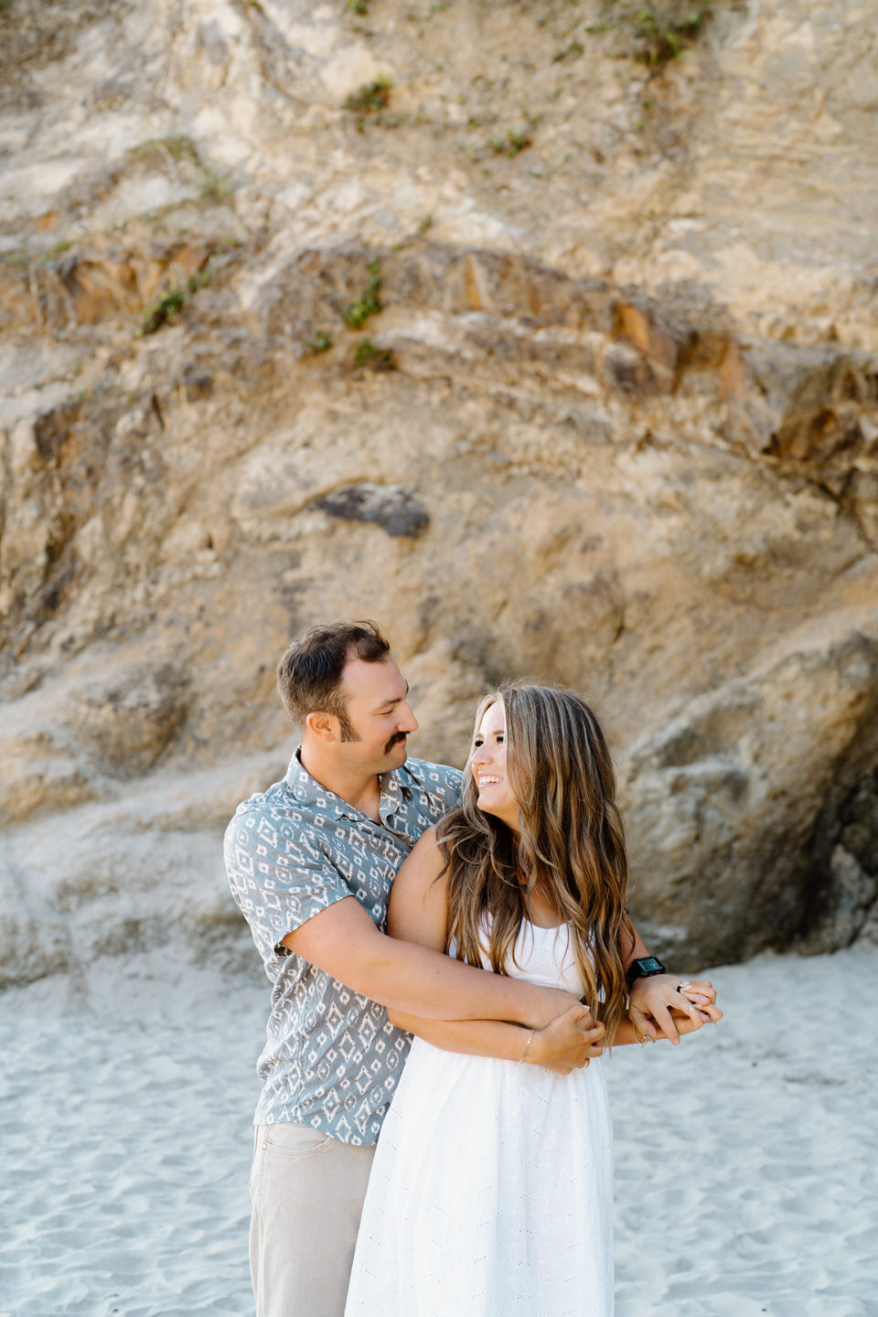 Couples photos at Hug Point on the Oregon Coast.