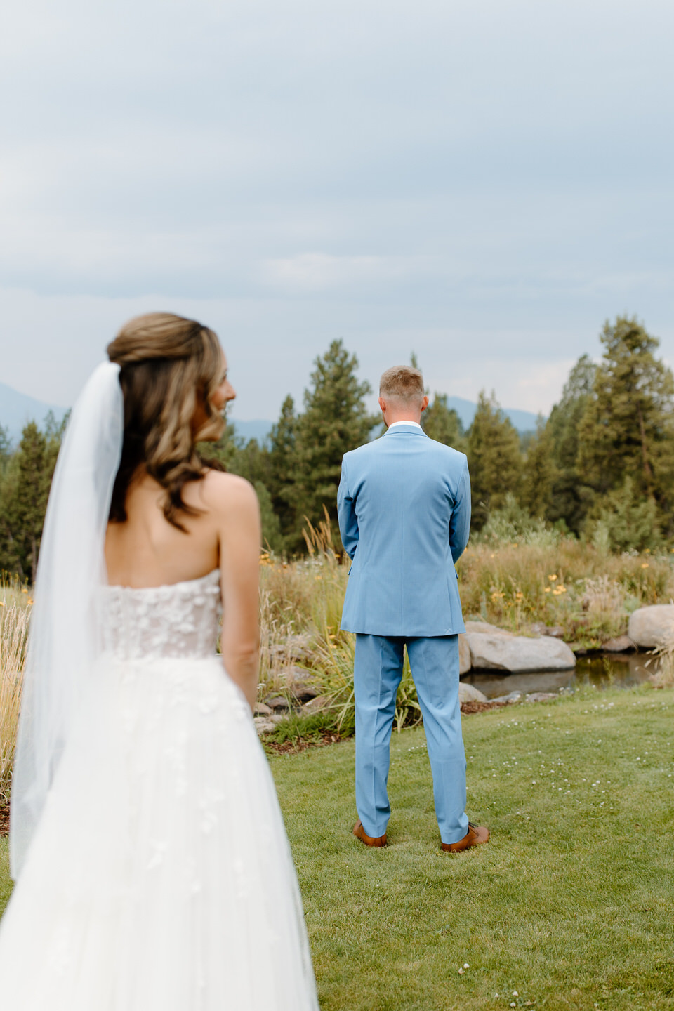 Bride walking up to groom for first look.