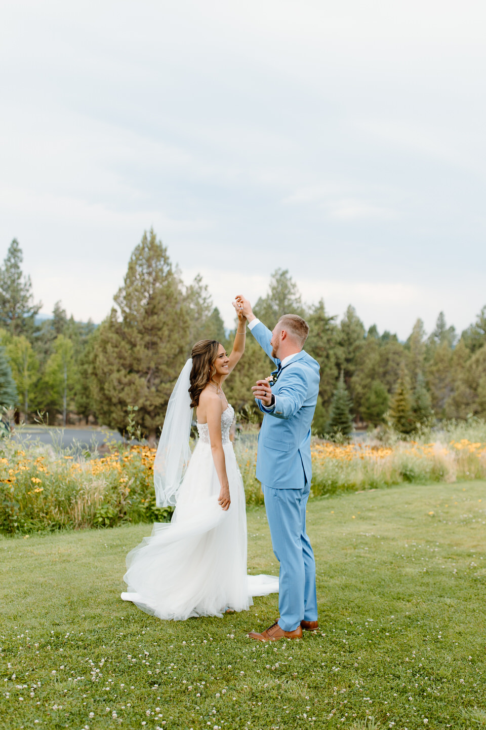 Bride and groom dancing on the lawn during Aspen Lakes Golf Course wedding.