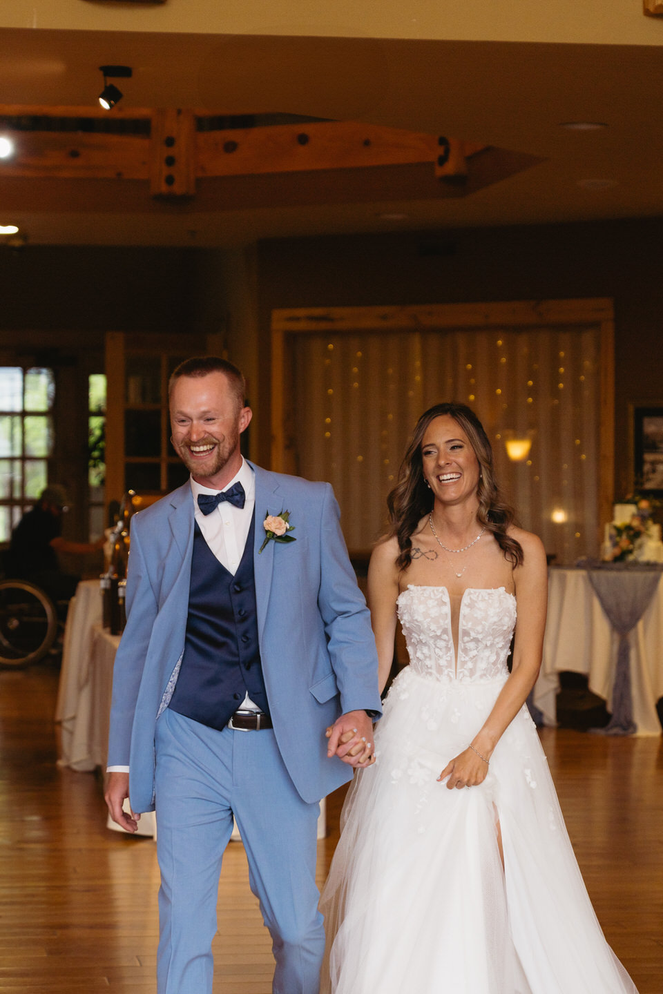 Bride and groom's grand entrance at Aspen Lakes Golf Course wedding.