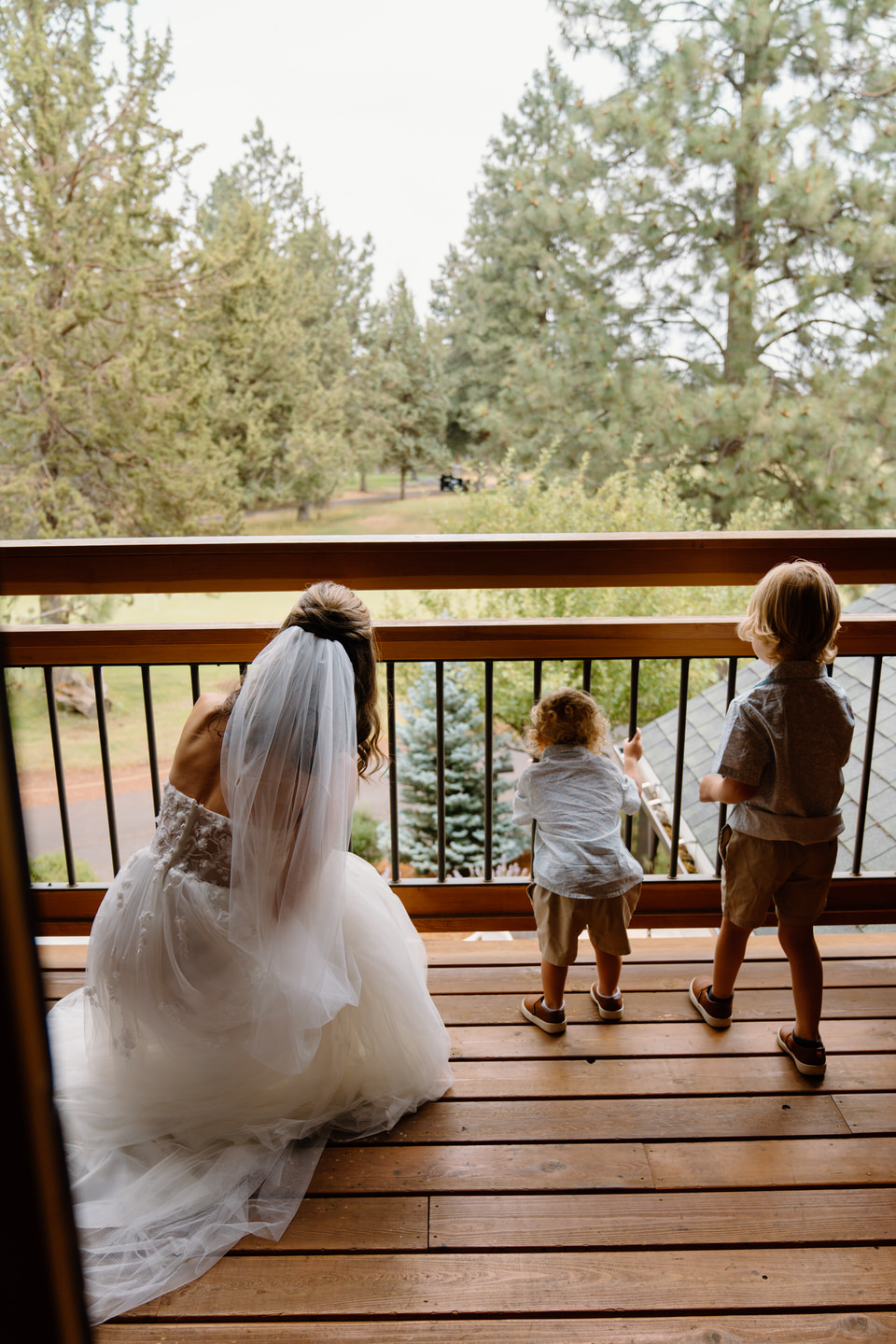 Bride and ring bearers looking over Aspen Lakes Golf Course.