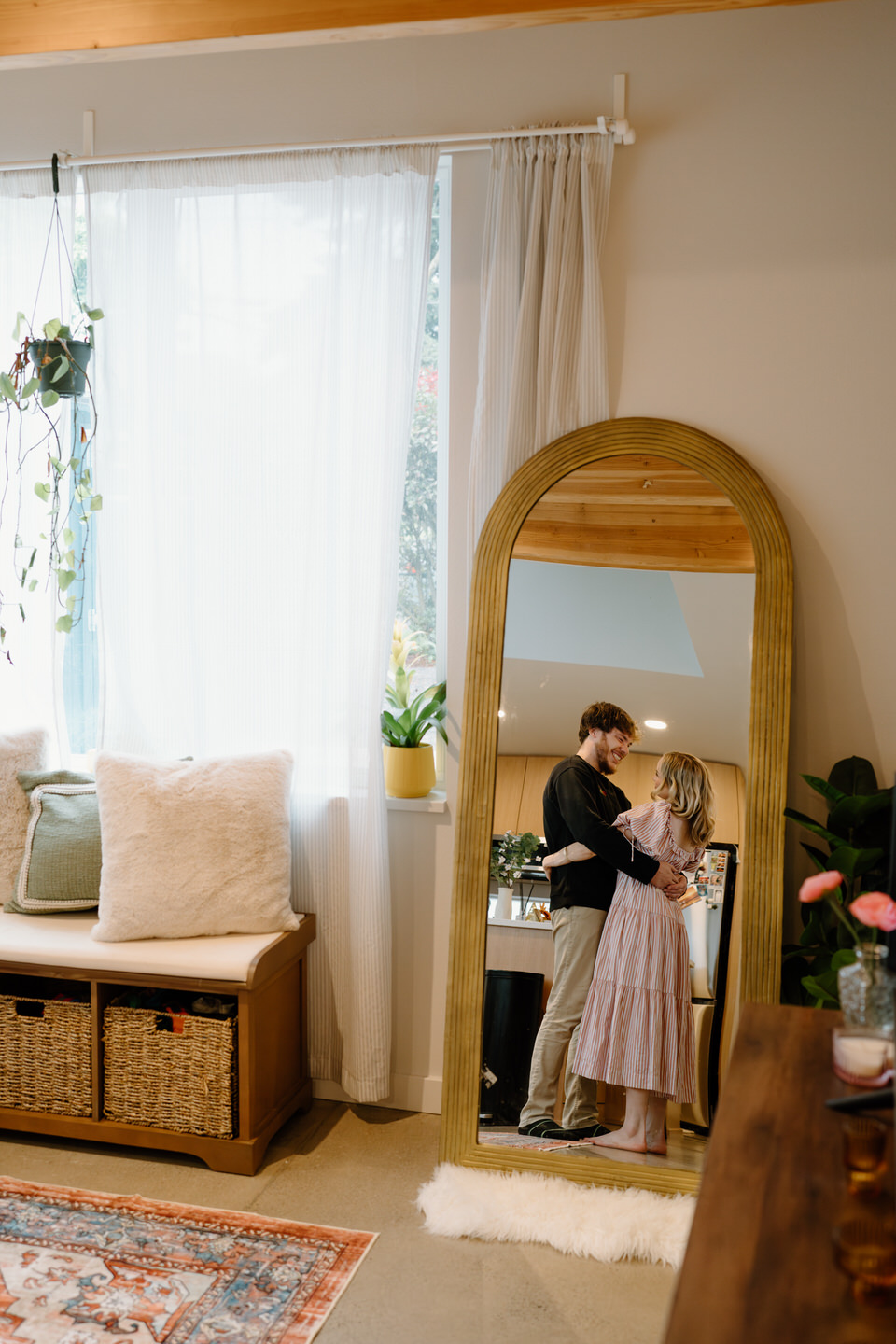 In-home couples session dancing in the reflection of a mirror