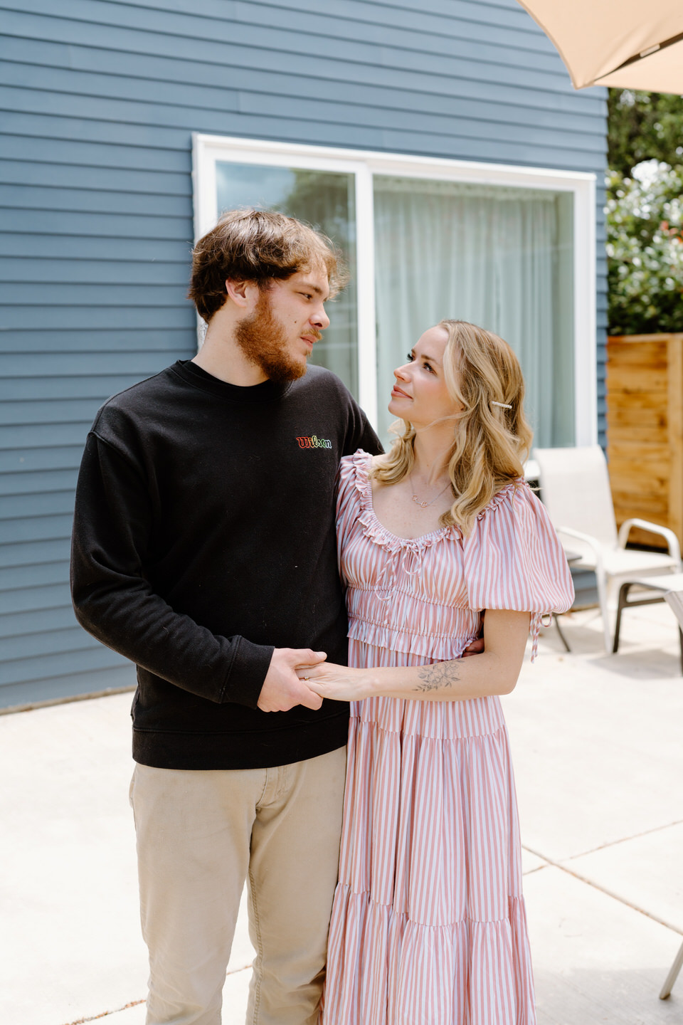 Couple in front of their new house in Portland, Oregon