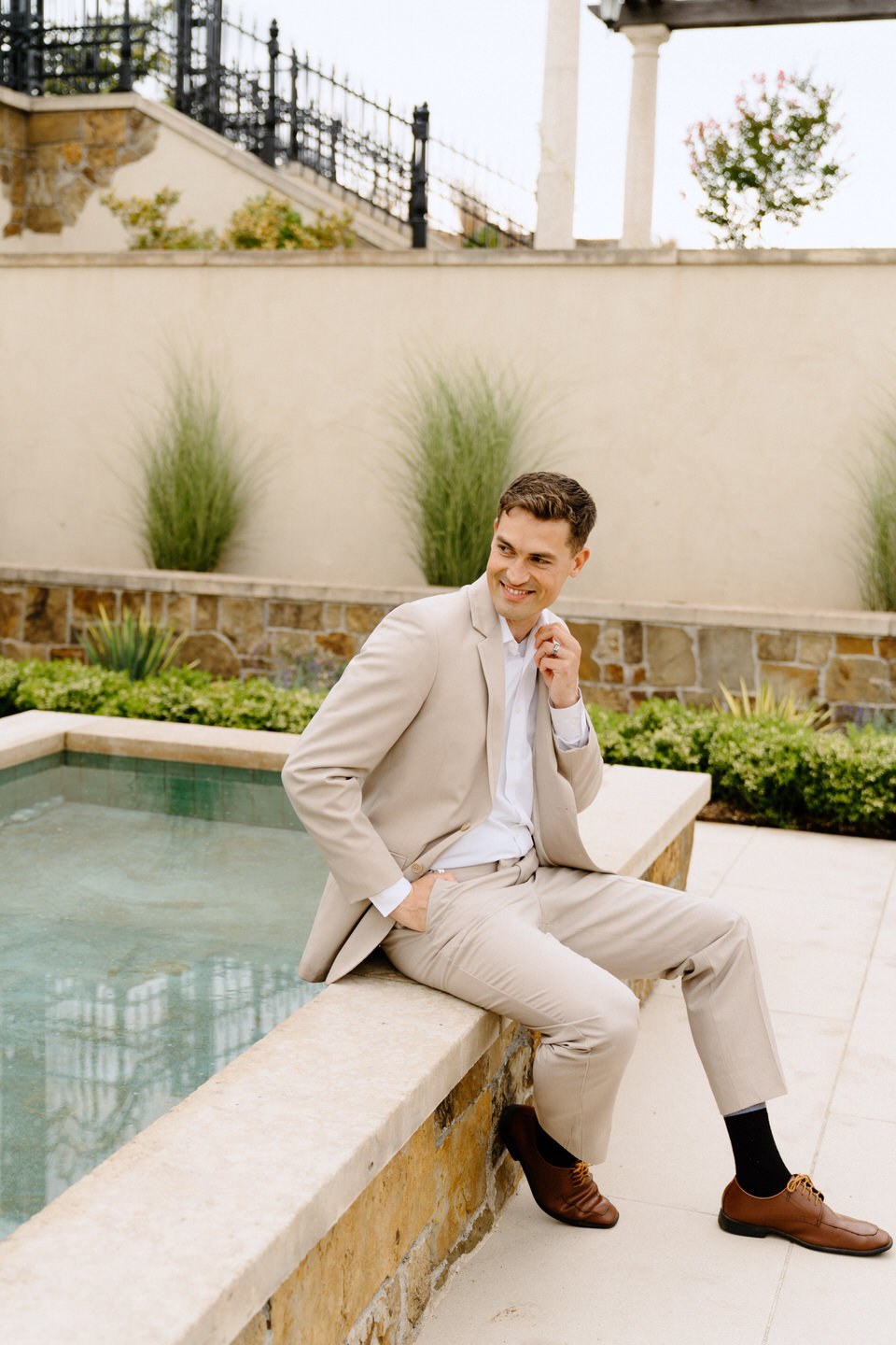 Groom wearing tan suit from Mr Formal rentals