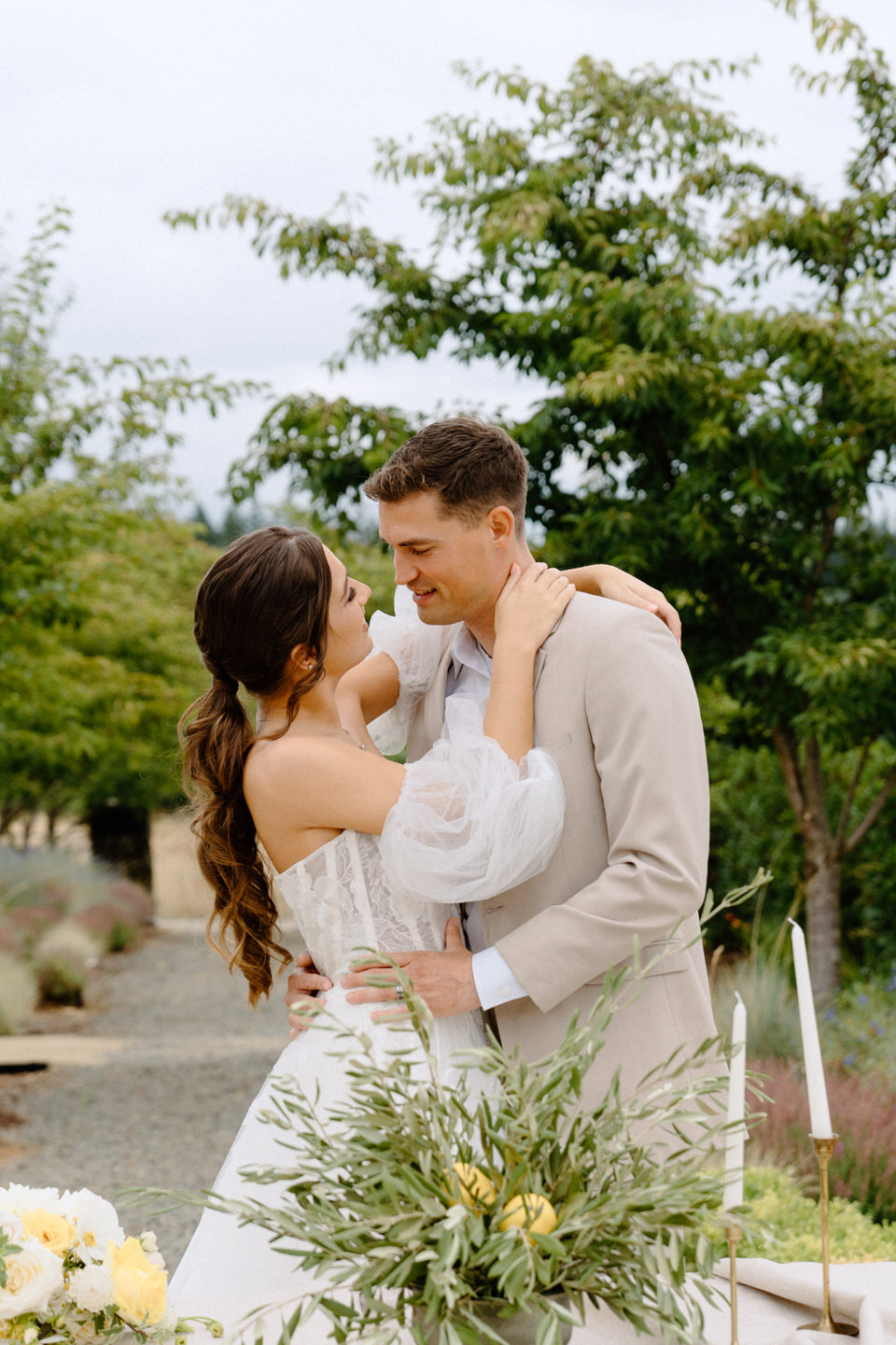 Bride and groom in front of their luxury sweetheart table