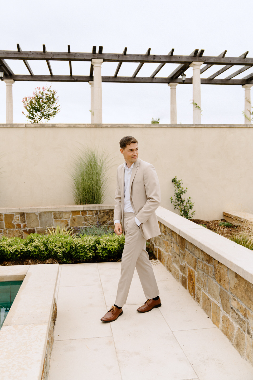 Groom portraits at luxury wedding at Chateau de Lis