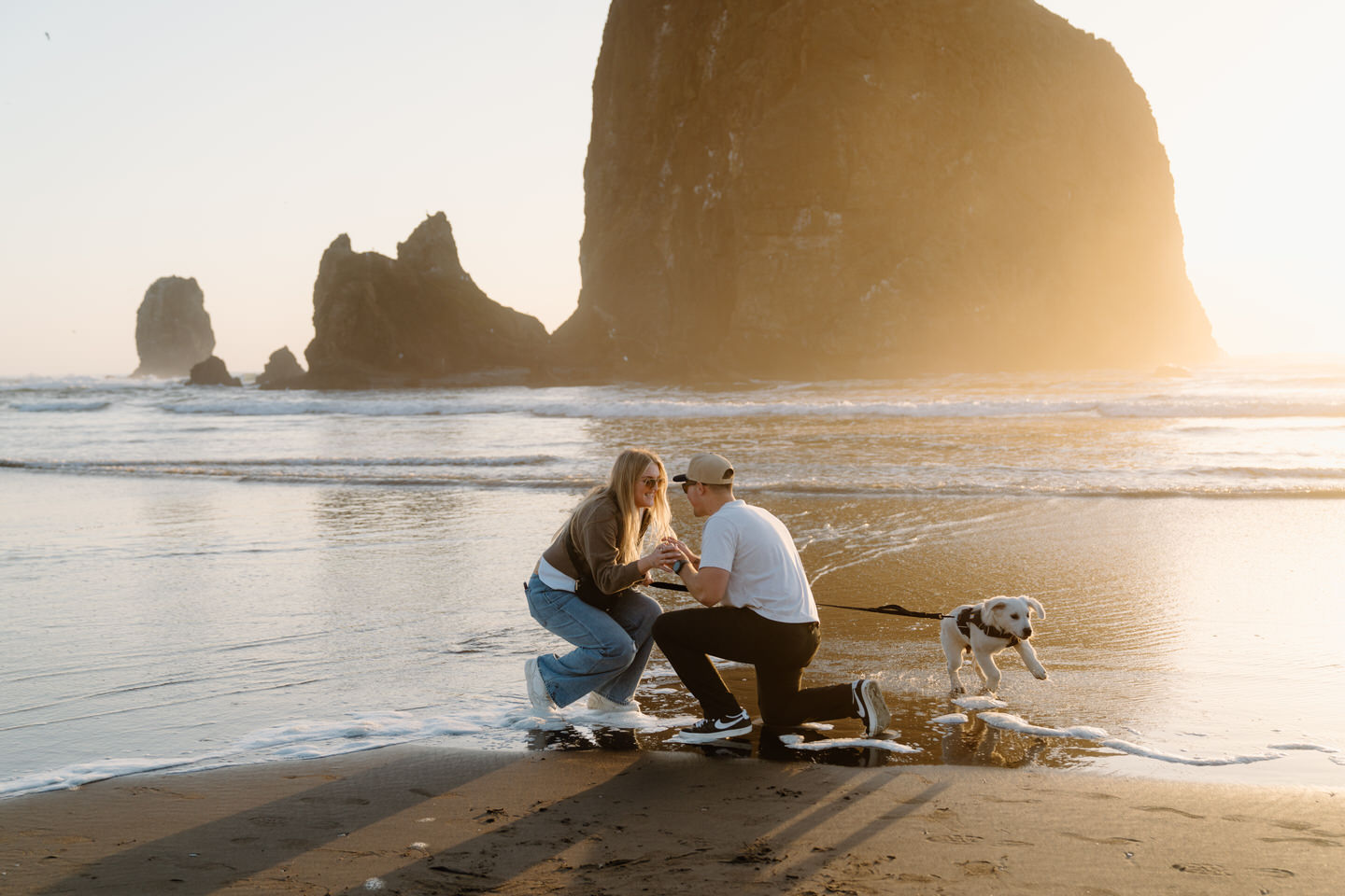 Couple in the sand at Cannon Beach