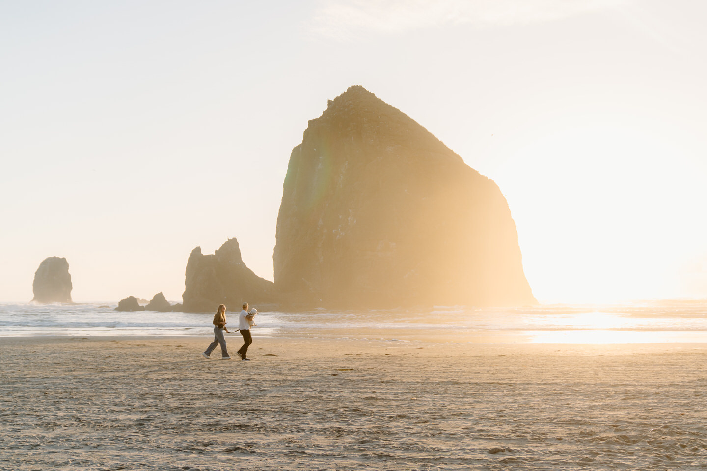 Oregon coast couple walking on the beach