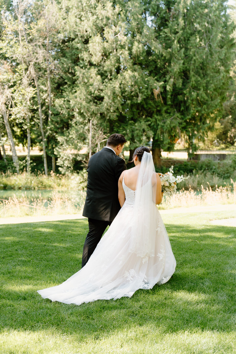 bride and groom exit ceremony at Springwater Lakes Estate wedding