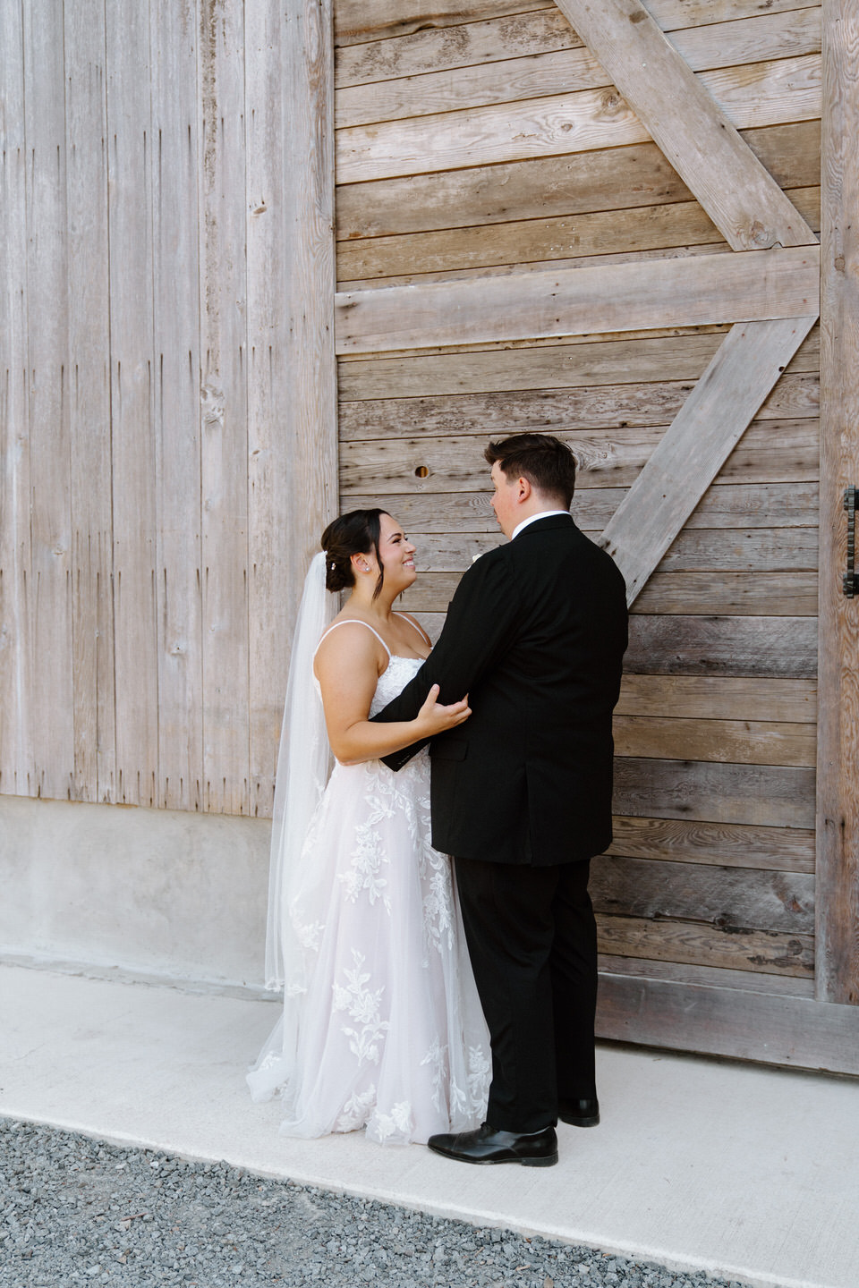 Bride and groom portraits at barn wedding venue