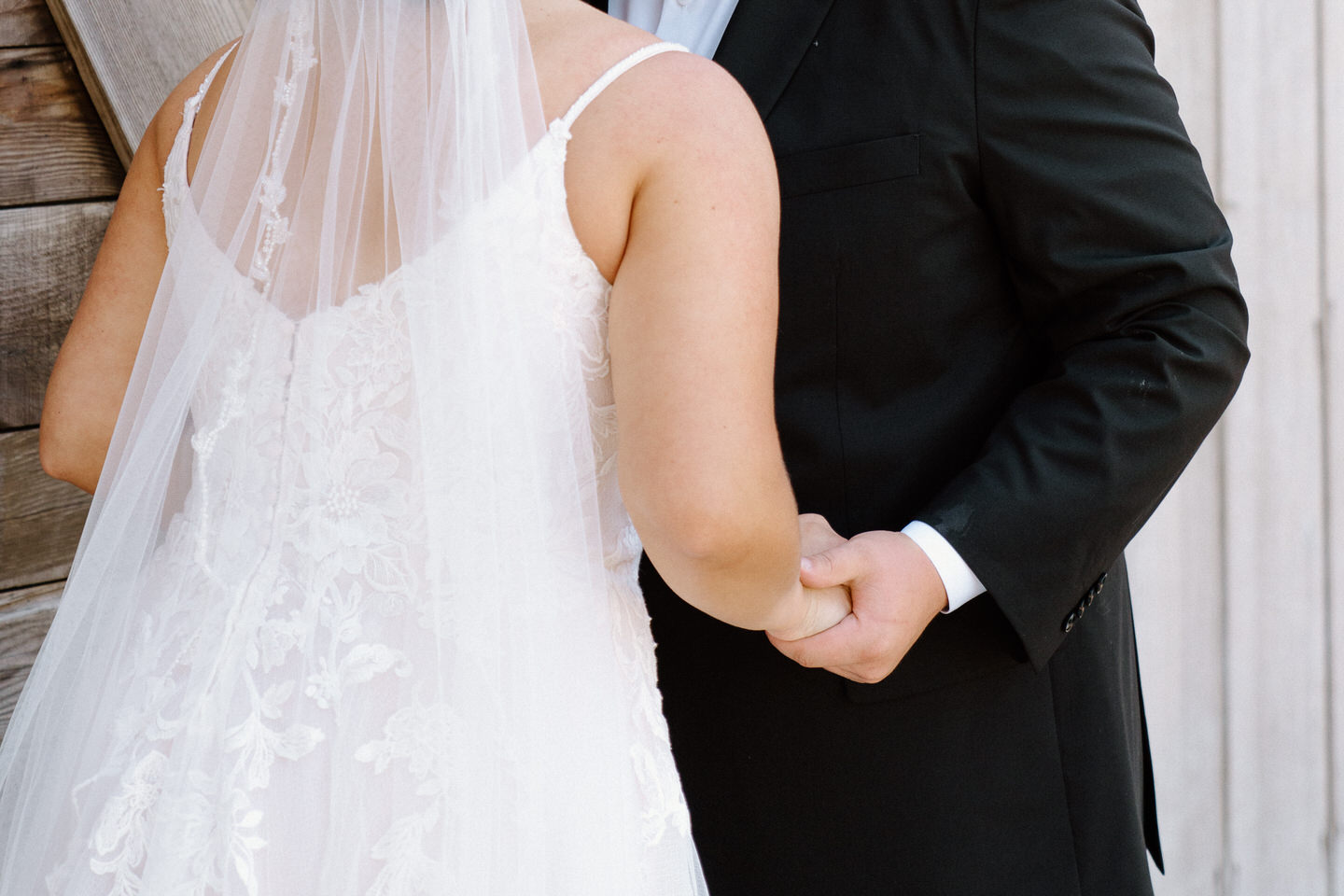 Bride and groom hold hands during Oregon wedding