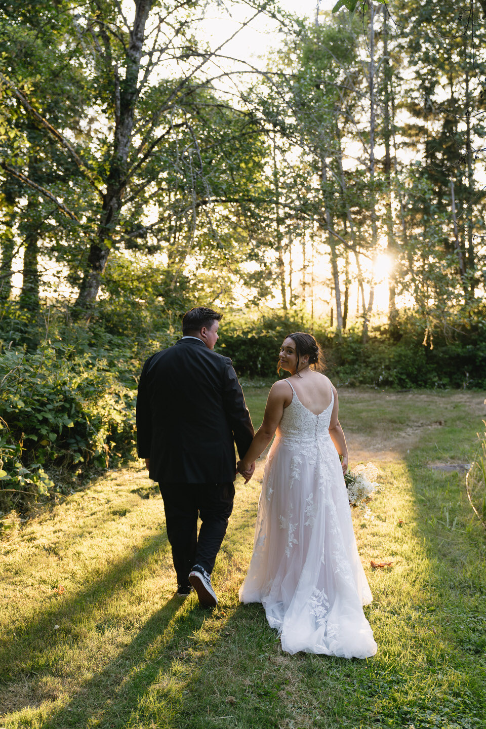 Bride looks over her shoulder during wedding portraits