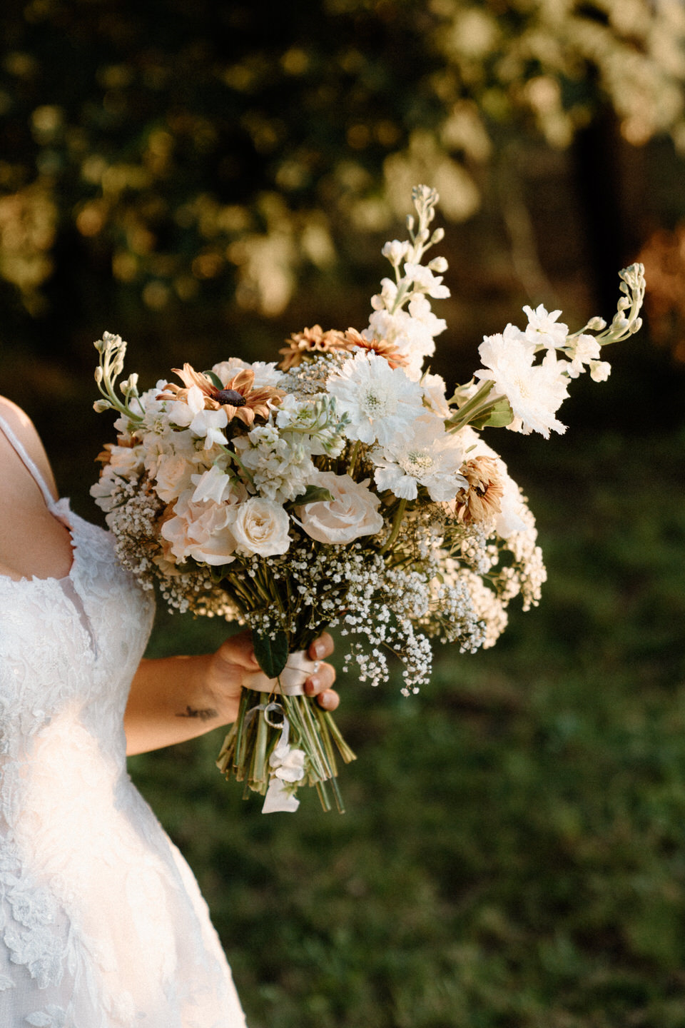 Bridal bouquet with pink, orange, and white flowers