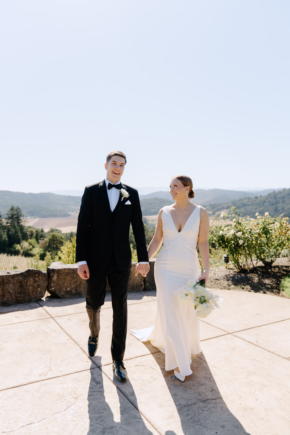 Couple walks together on a sunny day at Youngberg Hill