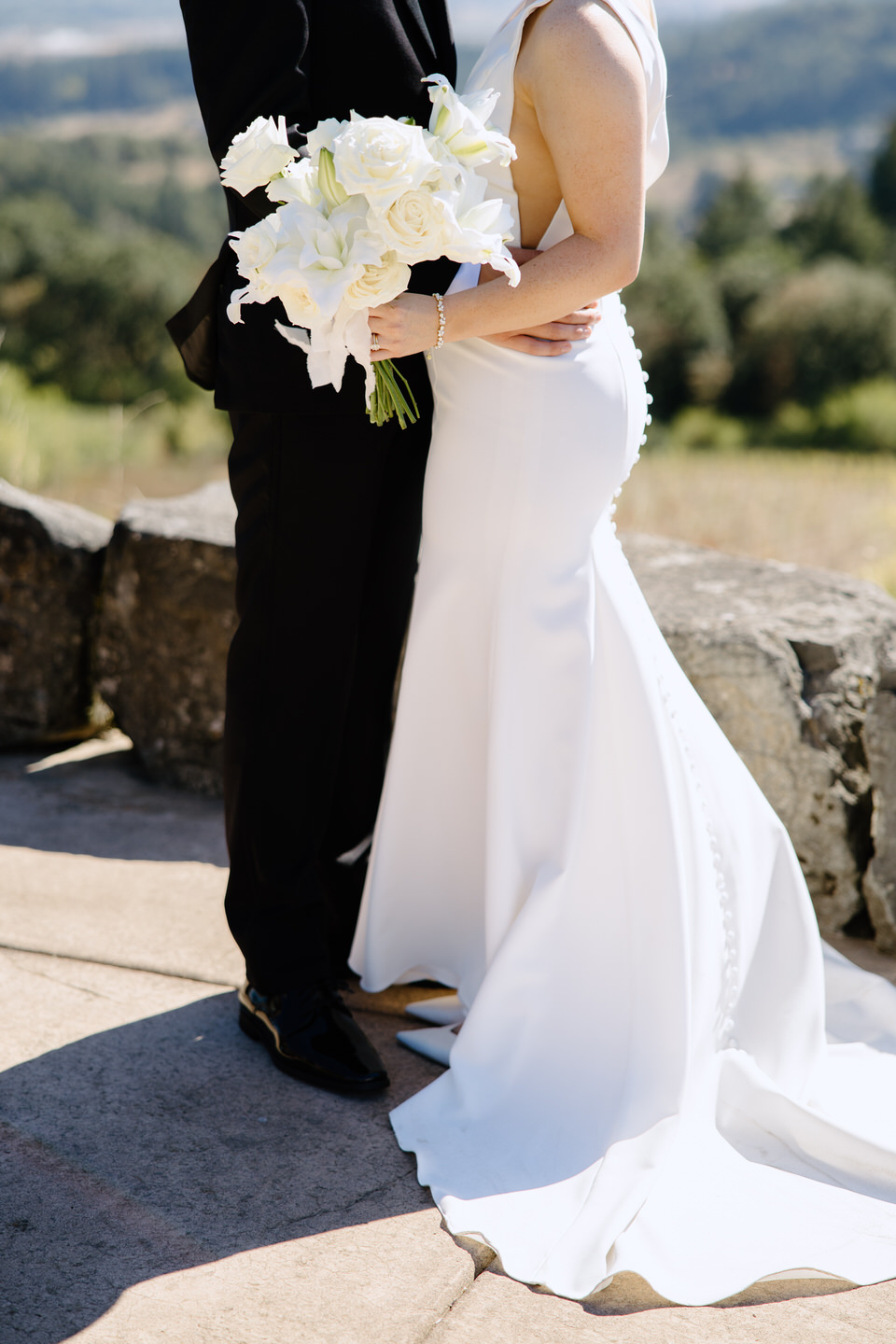 Train of wedding dress with view off of Youngerg Hill Winery.