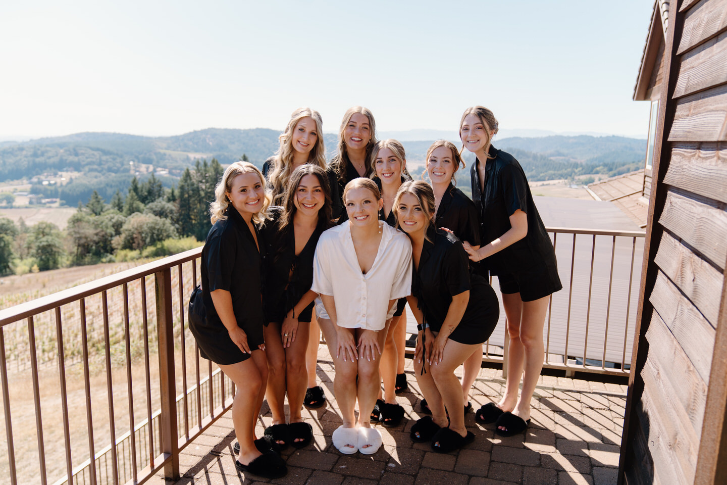 Bridal party in black matching pajamas at Youngberg Hill wedding.