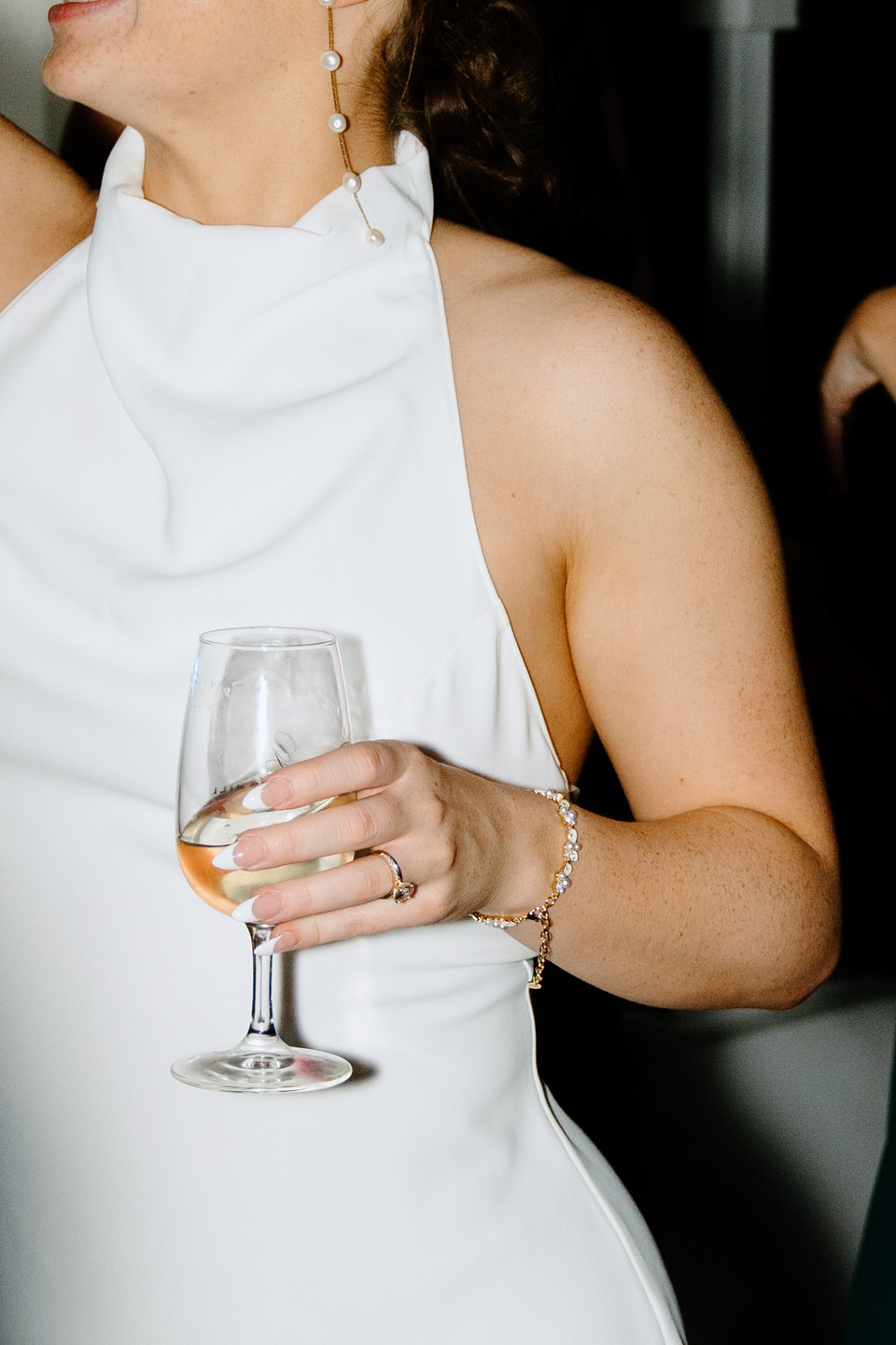 Bride details with her wine glass