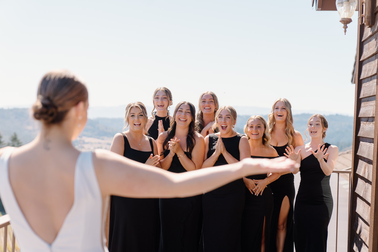 Bridesmaid first look on the balcony at Youngberg Hill Inn & Winery.