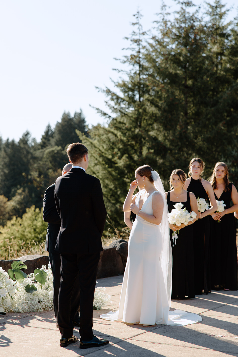 Bride tearing up during wedding ceremony