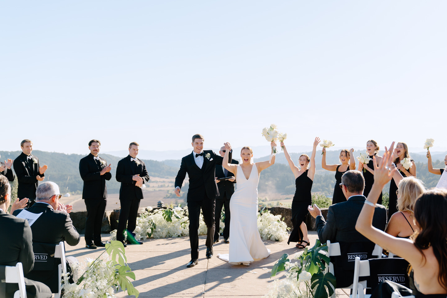 Bride and groom celebrate at the end of their wedding ceremony