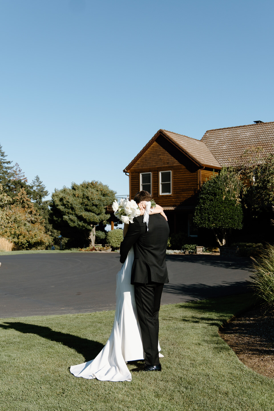 Bride and groom hug after their wedding ceremony