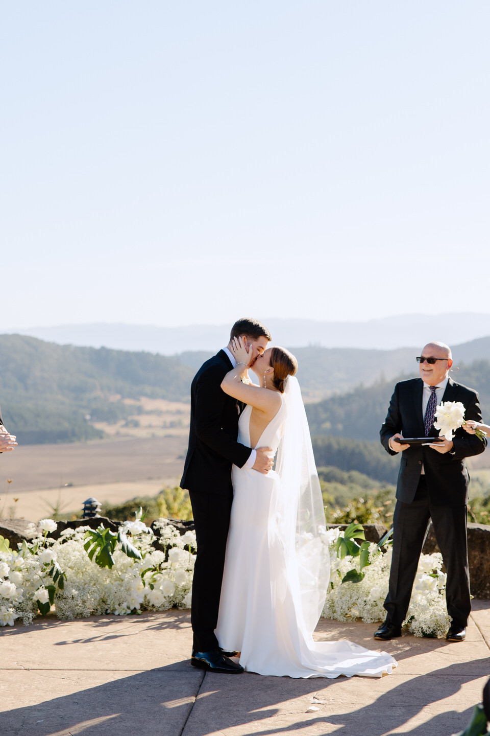 Bride and groom's first kiss at Youngberg Hill wedding