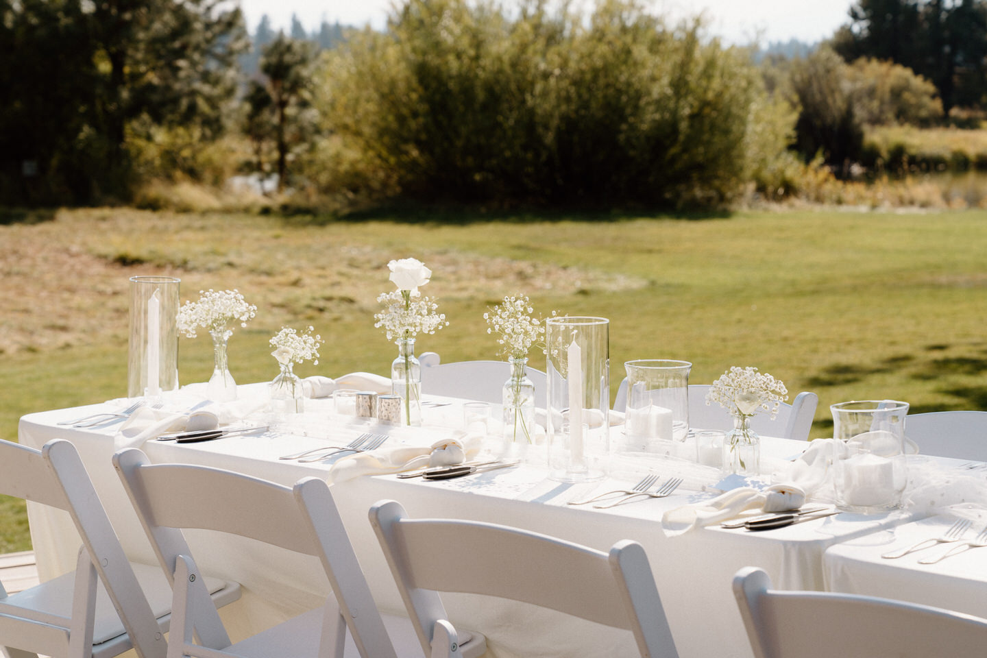 Minimalist white tablescape with clean lines, blending with the natural beauty of Black Butte, Oregon.