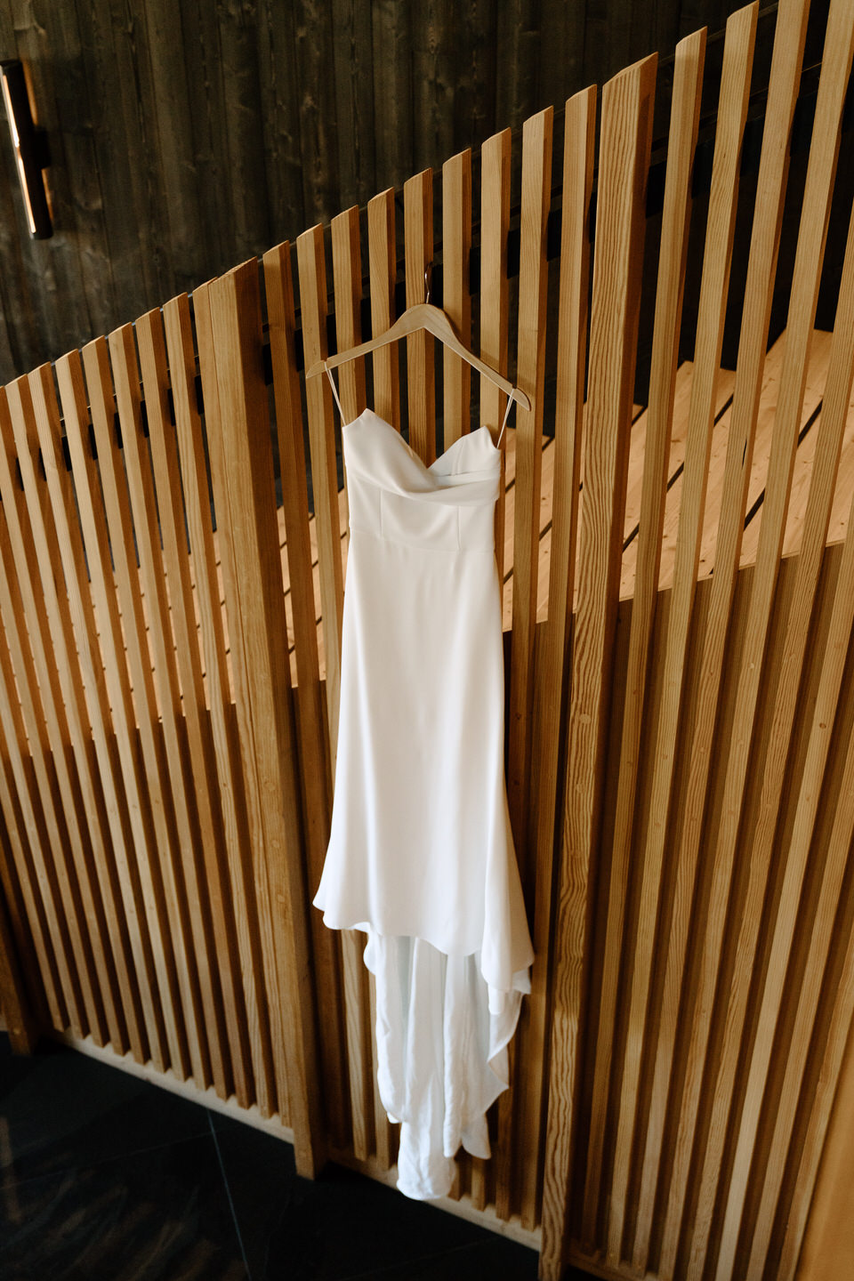 Alyssa Kristen wedding gown hanging in the lodge ahead of Black Butte Ranch wedding.