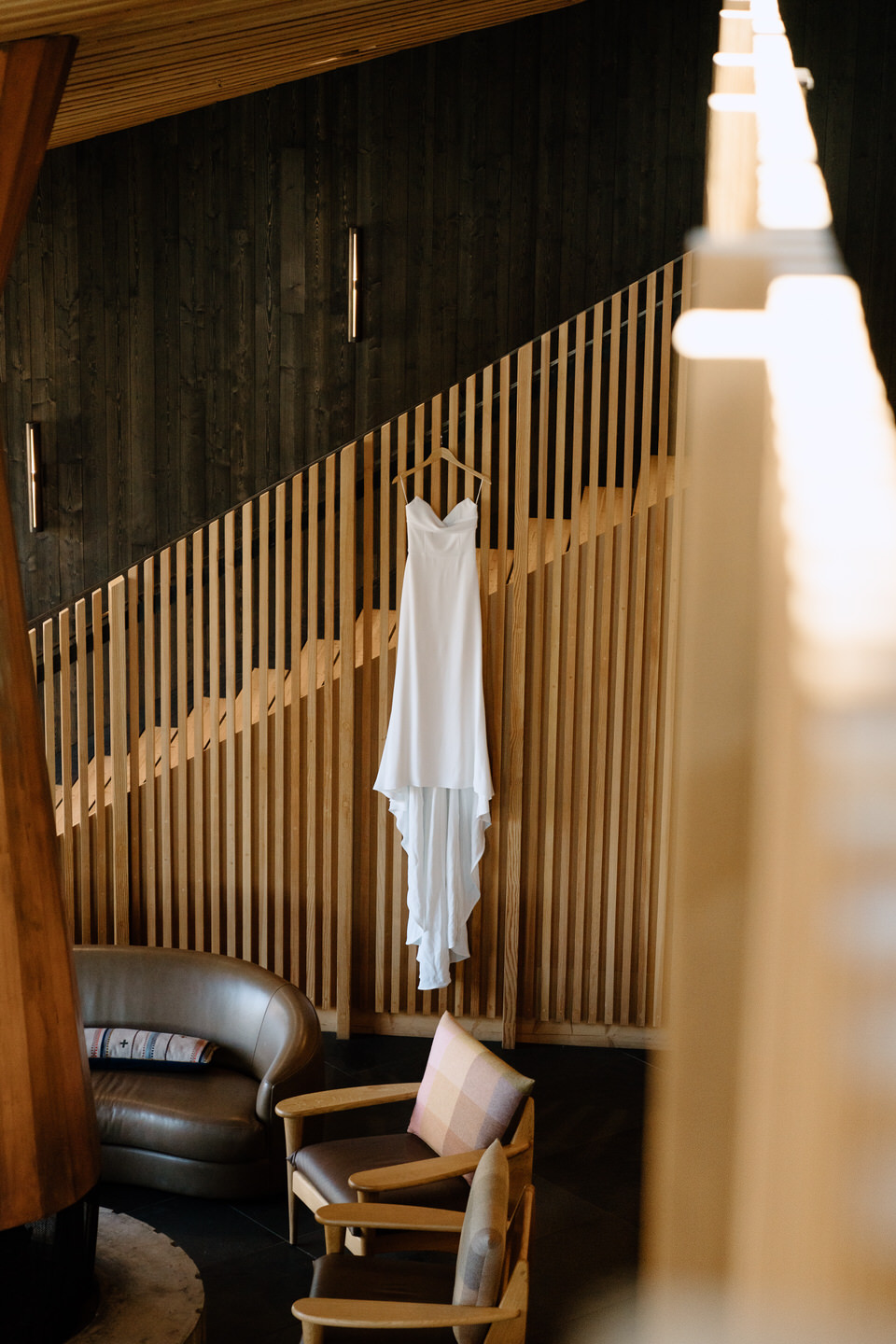 Alyssa Kristen wedding dress hanging in the lodge ahead of the Black Butte Ranch wedding.