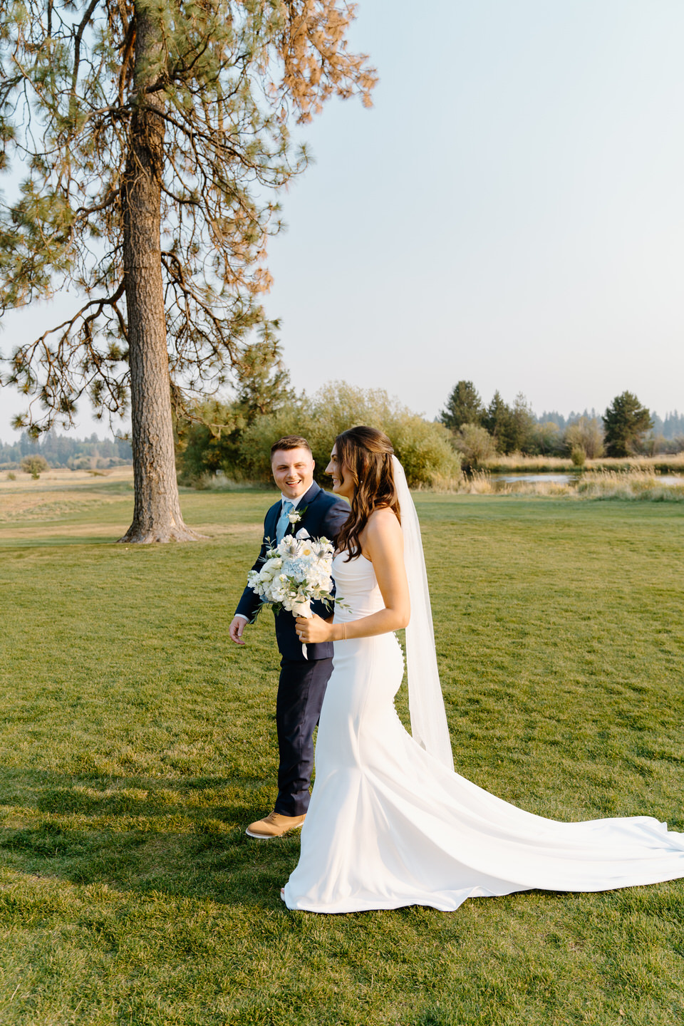 Bride and groom exiting their wedding ceremony among the Ponderosa Pine trees of Central Oregon.