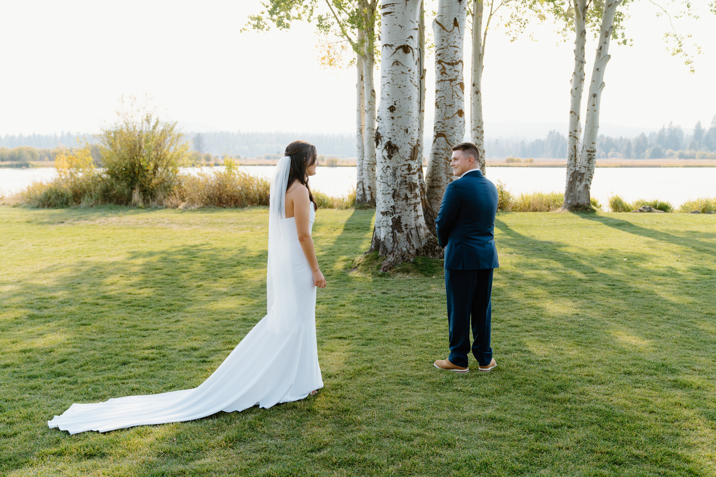 The groom turns to see his bride for the first time at Black Butte Ranch, with stunning views of Central Oregon as their backdrop.