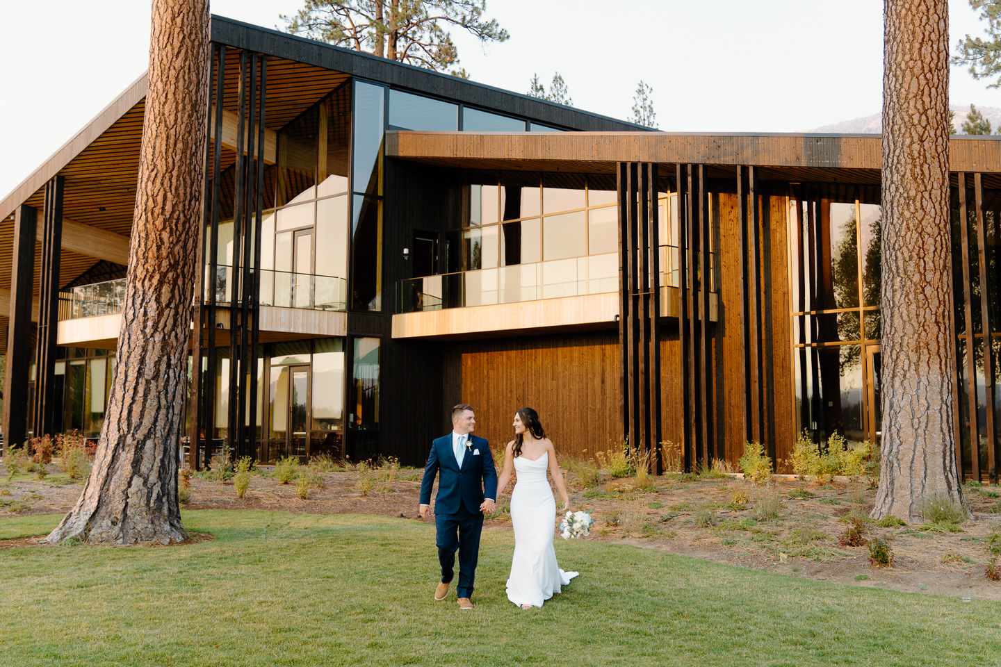 Walking together at sunset, the bride and groom share a quiet moment amidst Black Butte Ranch’s serene October beauty.