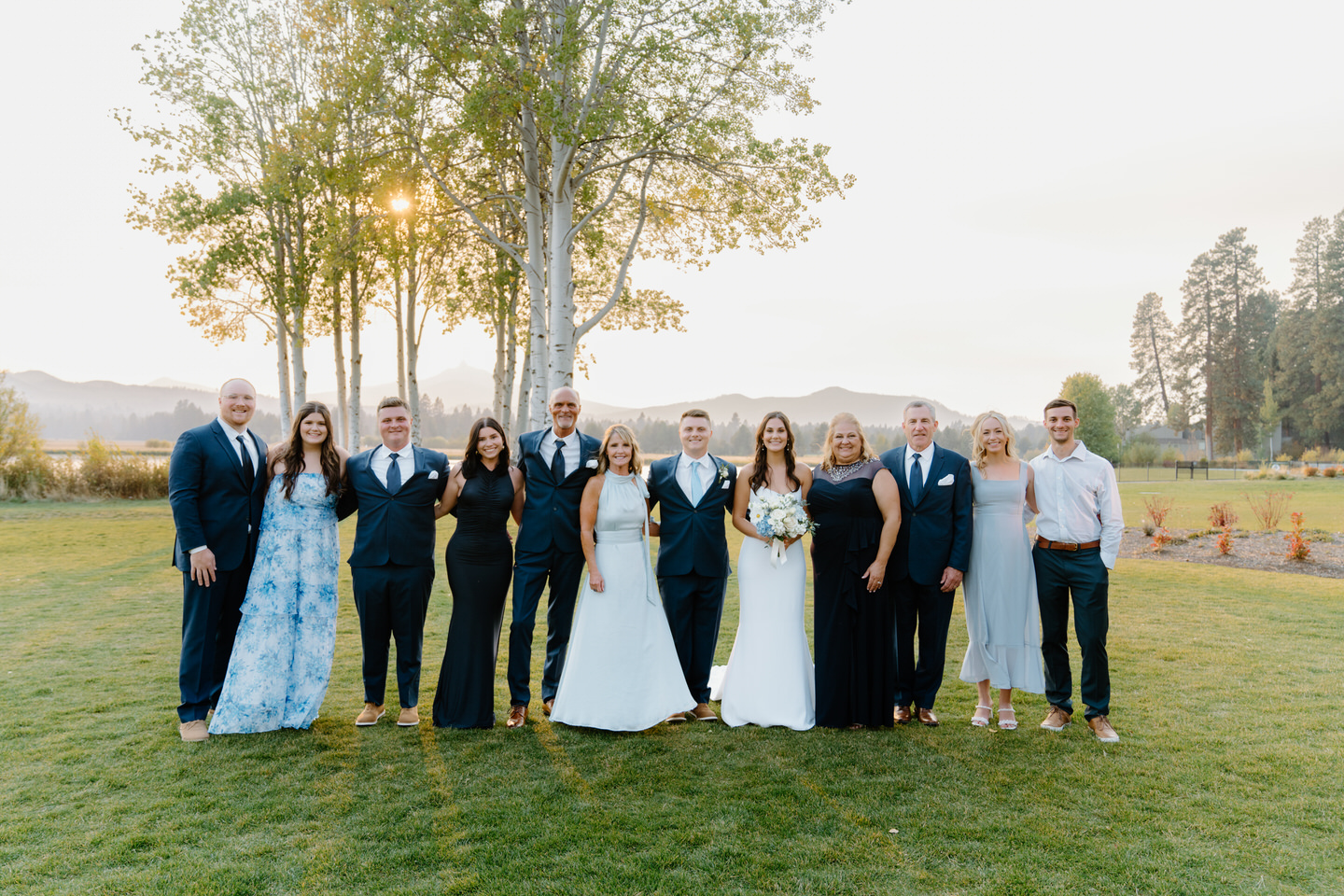 All of the guests at a small intimate wedding among aspen trees in Central Oregon.