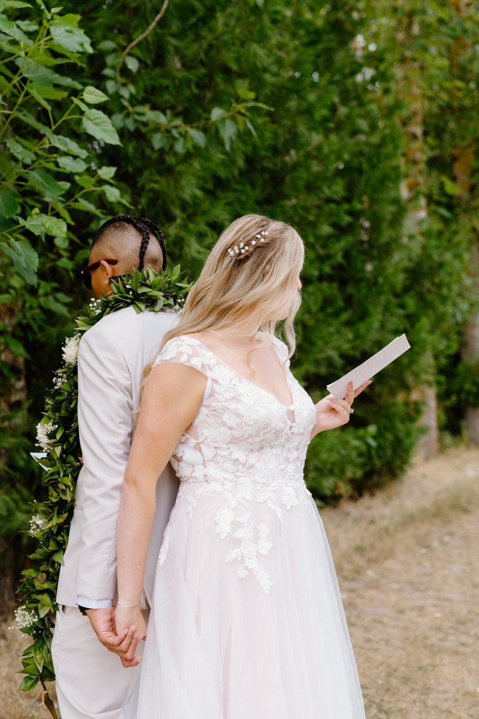 Bride reads her private vows to her groom ahead of wedding ceremony at Green Villa Barn & Gardens.