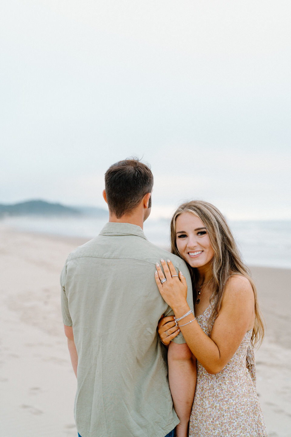 Woman smiling at camera for anniversary photos