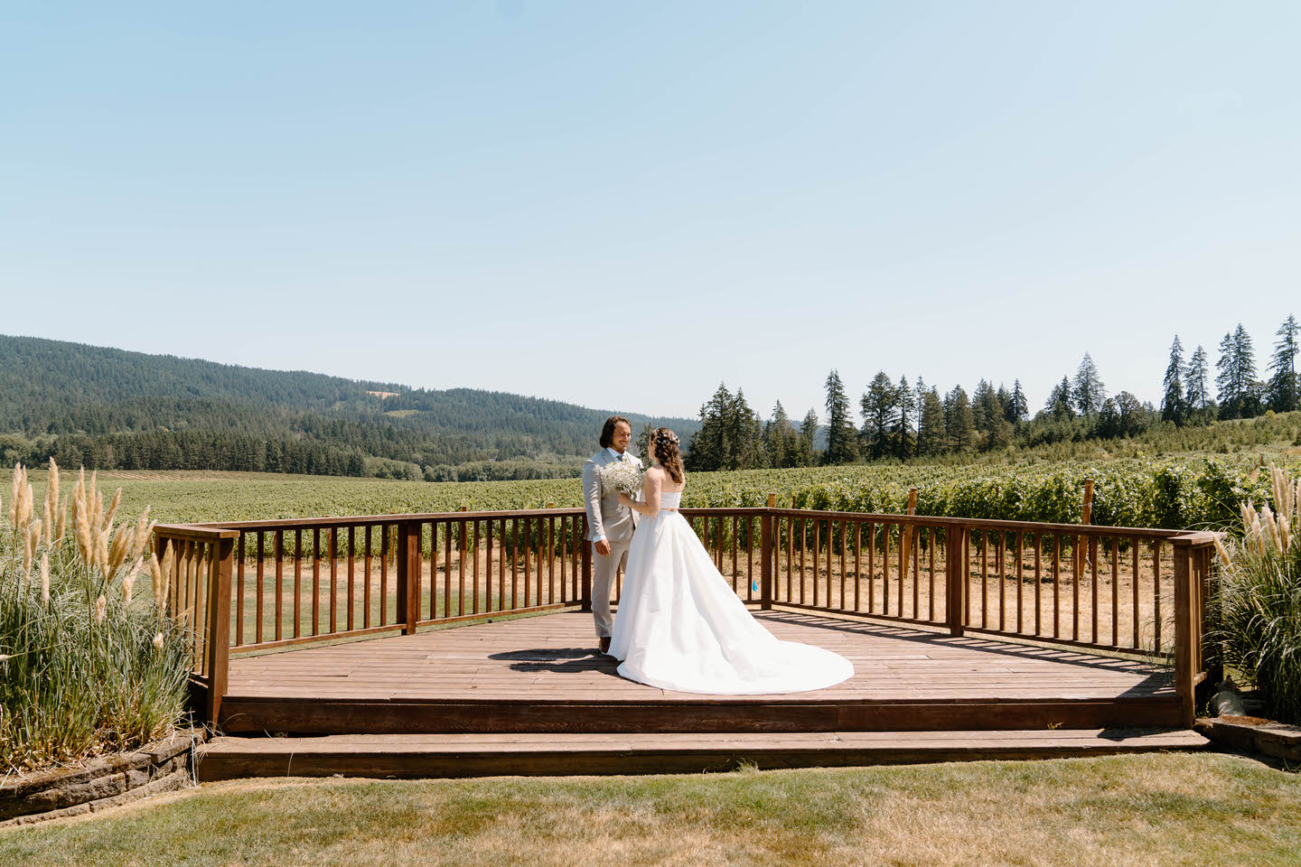 Bride and groom first look on the deck at Abbey Road Farm.