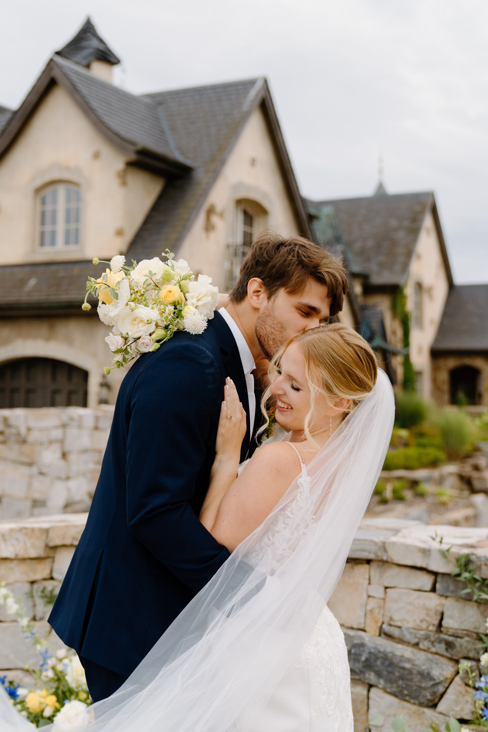 Kiss on the cheek on the stone bridge.